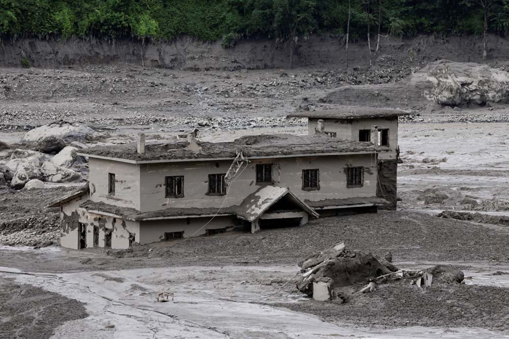 A mud-covered building following a flash flood at Trishuli, Nepal