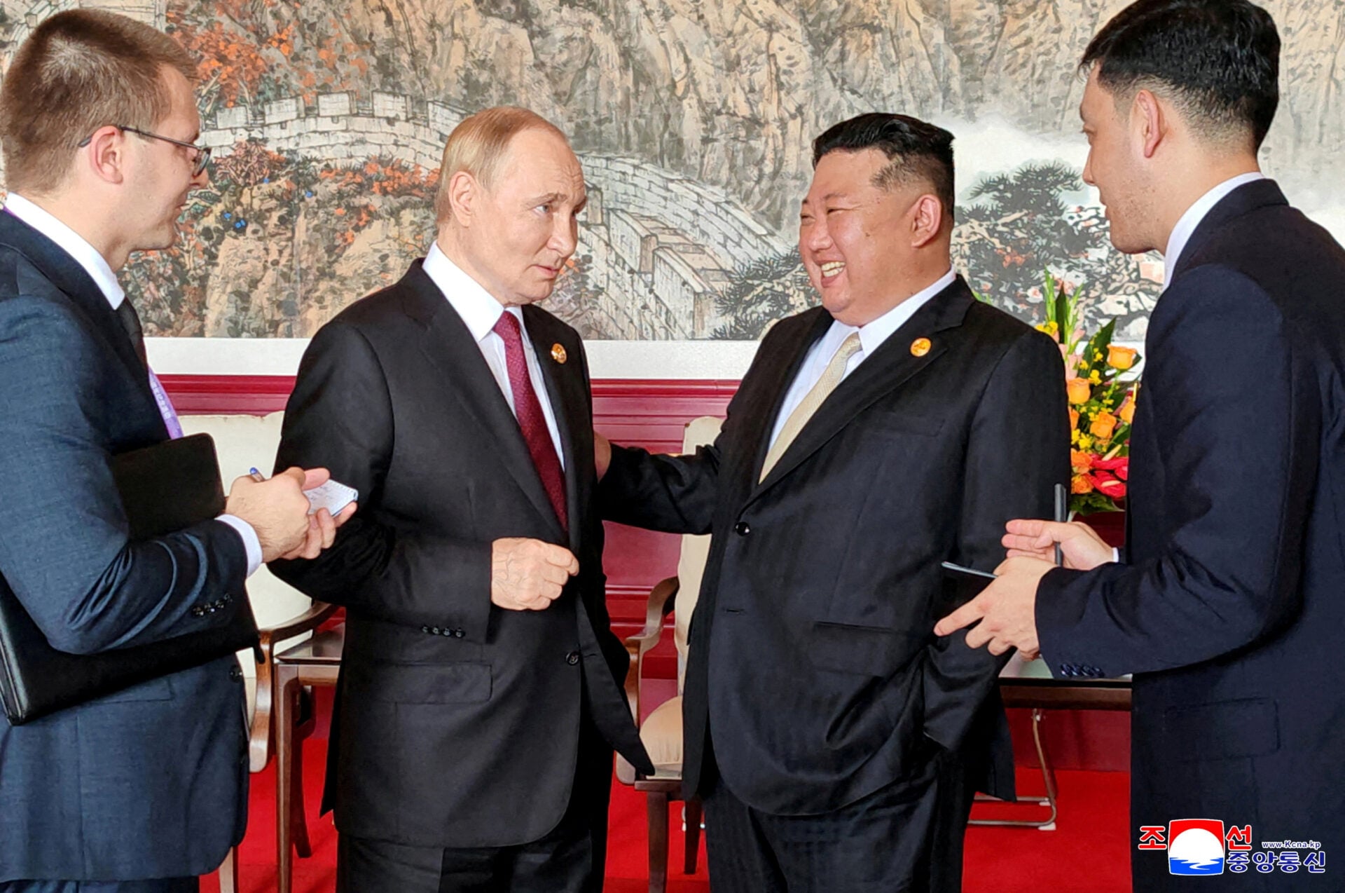 FILE PHOTO: Russian President Vladimir Putin and North Korean leader Kim Jong Un in Beijing