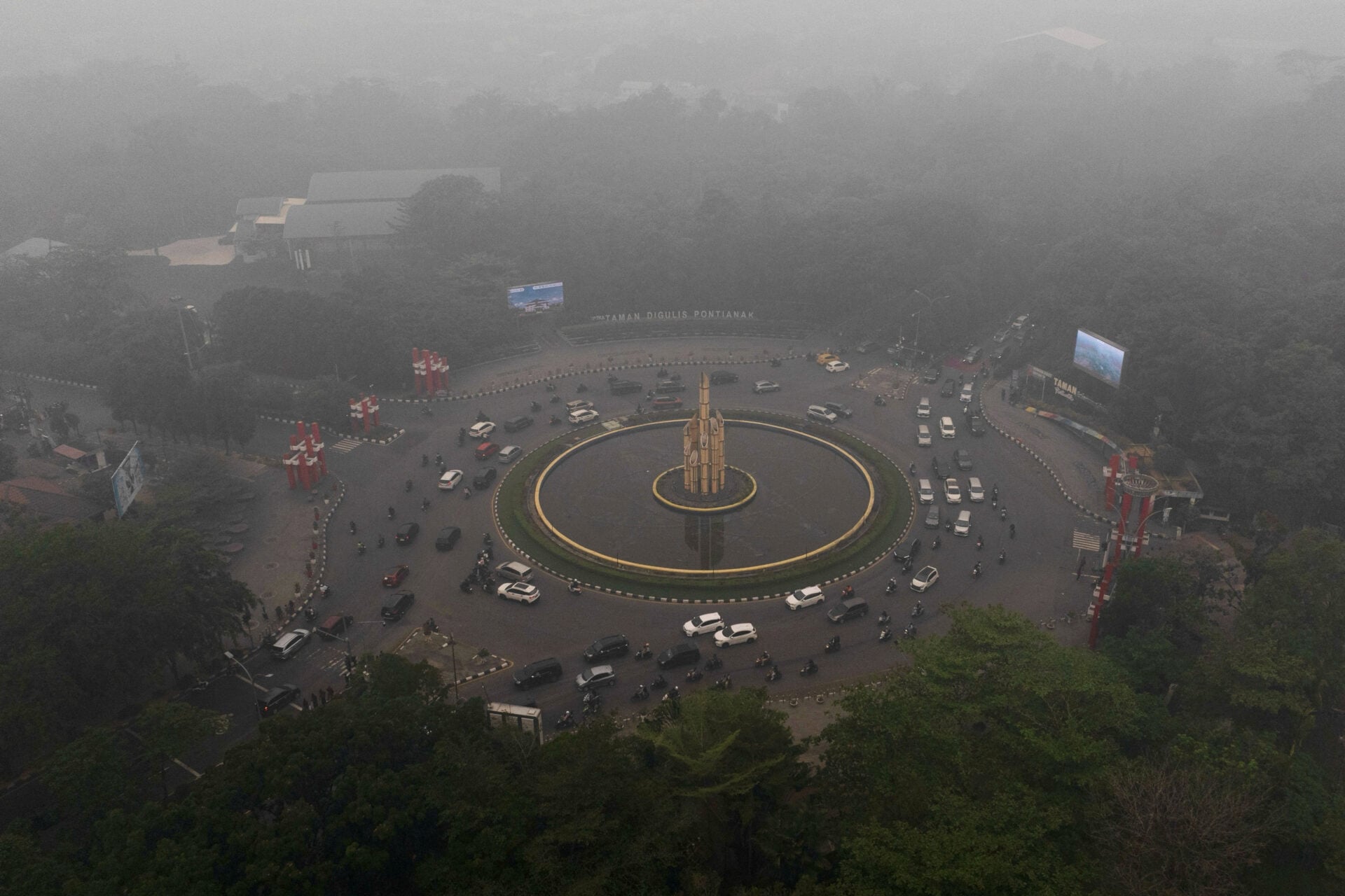 A drone view shows Digulis roundabout shrouded in haze from wildfires in Pontianak