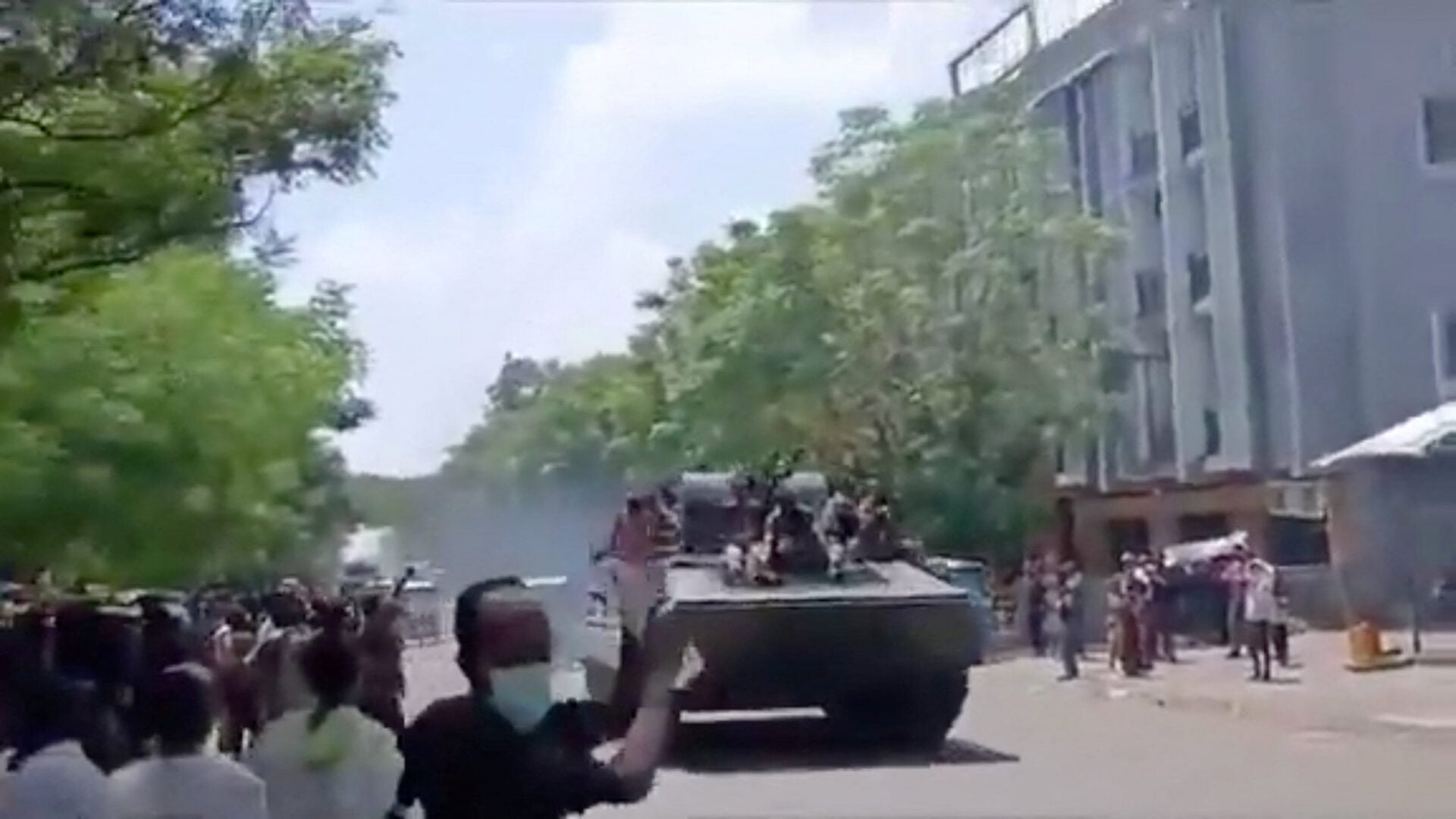 Armed men on armoured vehicles drive through Alamata