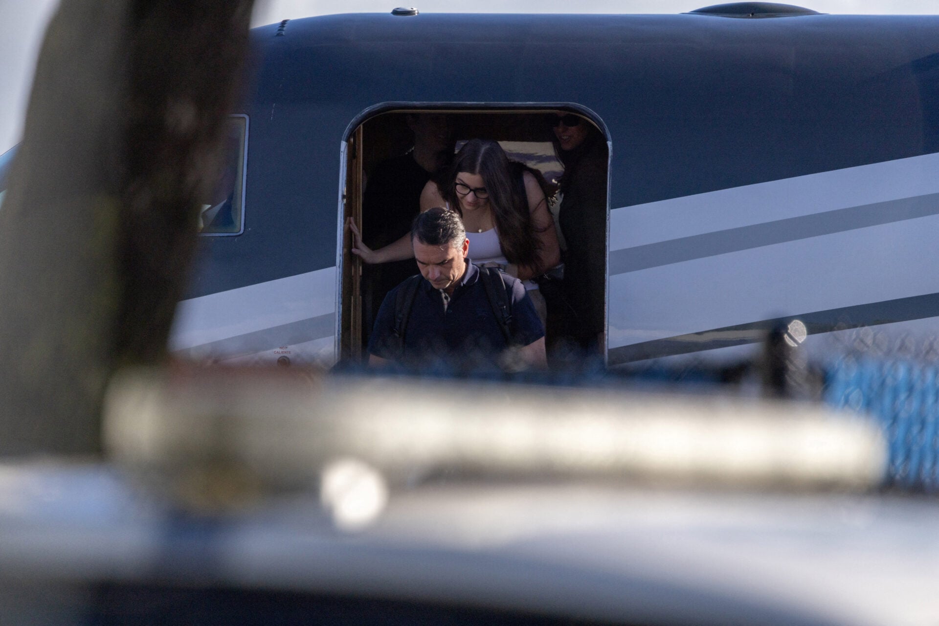 Brazilian Senator Flavio Bolsonaro disembarks from a plane after arriving at Opa-locka Executive Airport near Miami