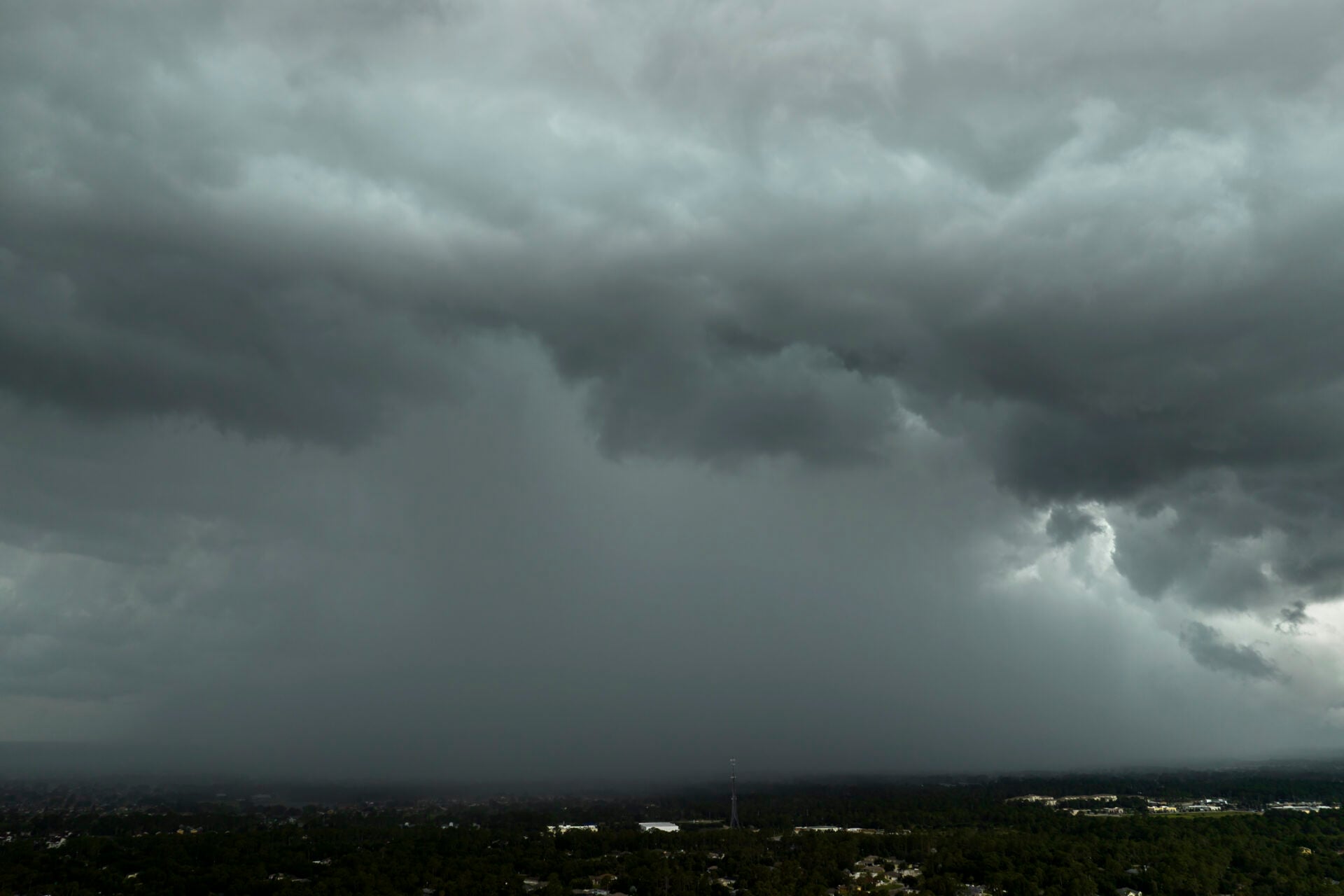 Stormy cumulus clouds forming during heavy thunderstorm on dark sky. Moving and changing cloudscape weather